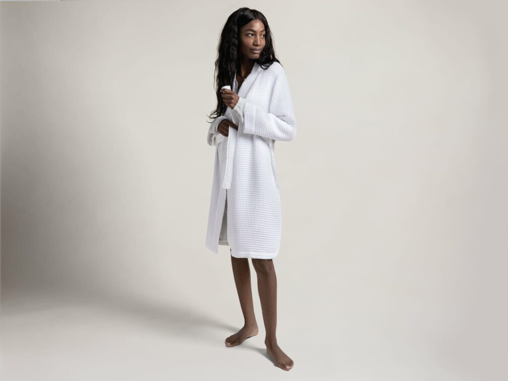 Image of a woman in the white Waffle Robe from Parachute Home